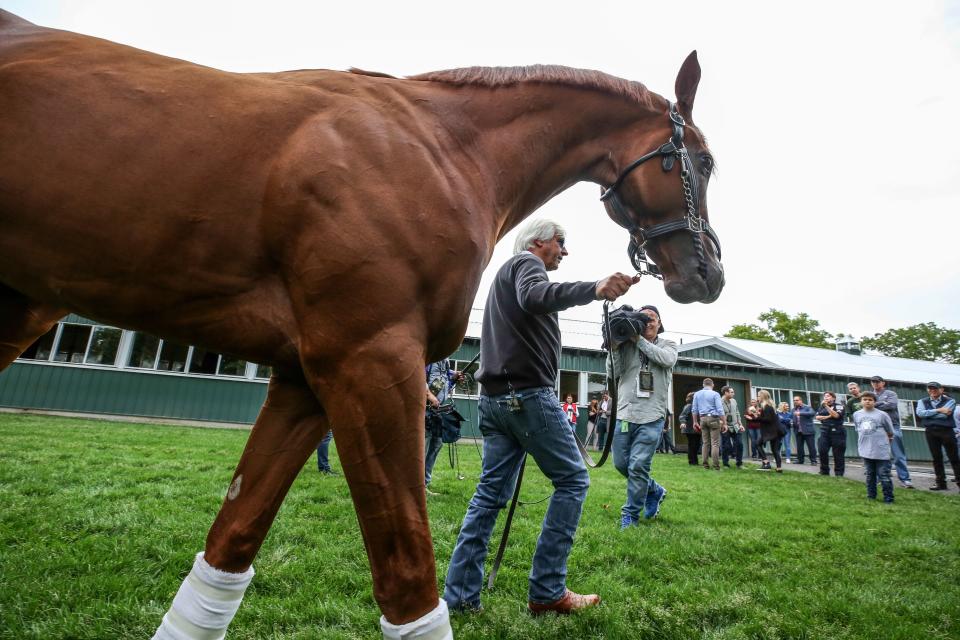 Bob Baffert brings Triple Crown winner Justify out to see the media outside of the barn at Belmont Park on Sunday morning. June 10, 2018