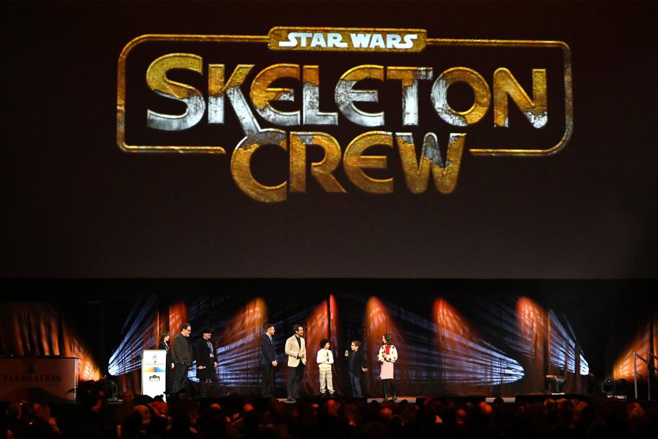 LONDON, ENGLAND - APRIL 07: (L-R) Kathleen Kennedy, John Favreau, Dave Filoni, Presenter Ali Plumb, Jude Law, Ravi Cabot Conyers, Robert Timothy Smith and Kyrianna Kratter onstage during the studio panel for Skeleton Crew at the Star Wars Celebration 2023 in London at ExCel on April 07, 2023 in London, England. (Photo by Kate Green/Getty Images for Disney)