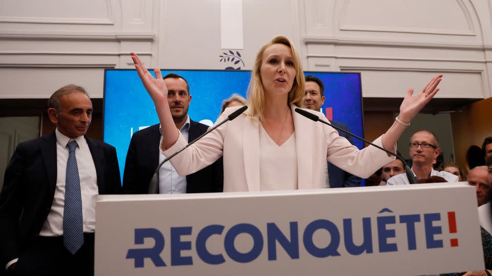 Marion Marechal addresses supporters of her party, Reconquest, alongside party president Eric Zemmour, left, on Sunday. Marechal and Zemmour have since had a falling out. - Ian Langsdon/AFP/Getty Images