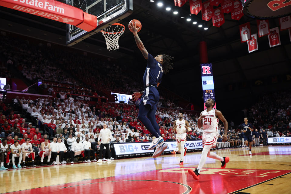 Jan 31, 2024; Piscataway, New Jersey, USA; Penn State Nittany Lions guard Ace Baldwin Jr. (1) goes up for a basket during the first half in front of Rutgers Scarlet Knights guard Austin Williams (24) and forward Aundre Hyatt (5) at Jersey Mike’s Arena. Mandatory Credit: Vincent Carchietta-USA TODAY Sports