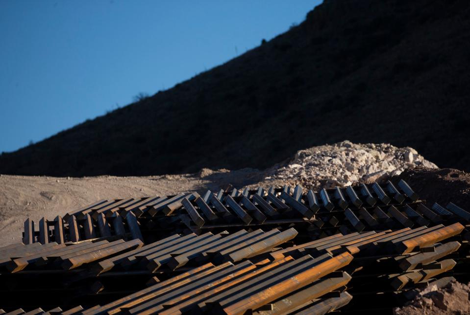 Construction supplies for the border wall sit stacked at Guadalupe Canyon, Arizona, after the Biden administration halted work on the barriers.