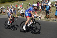 Belgium's Edward Theuns, left, and Switzerland's Stefan Kung ride during the 14th stage of the Tour de France cycling race over 194 kilometers (120,5 miles) with start in Clermont-Ferrand and finish in Lyon, France, Saturday, Sept. 12, 2020. (AP Photo/Thibault Camus)