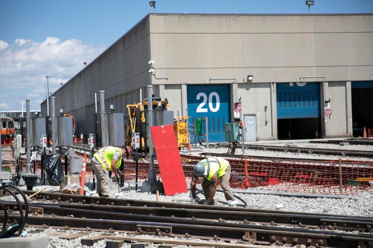 Crews work on MBTA Orange Line tracks near Wellington Station on Aug. 3, 2022.