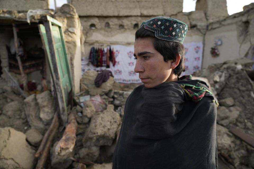 A man stands among destruction after an earthquake in Gayan village, in Paktika province, Afghanistan, Thursday, June 23, 2022. A powerful earthquake struck a rugged, mountainous region of eastern Afghanistan early Wednesday, flattening stone and mud-brick homes in the country's deadliest quake in two decades, the state-run news agency reported. (AP Photo/Ebrahim Nooroozi)