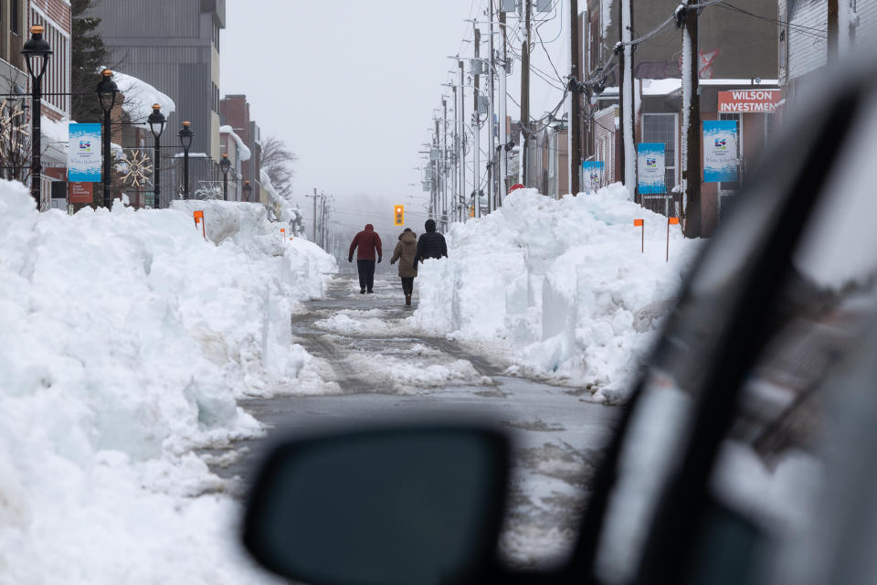 Residents walking down Charlotte St. after winter storm in Sydney, N.S. on Monday, Feb.5, 2024. A local state of emergency remained in effect in parts of Cape Breton on Monday, as Nova Scotia dug out from one of the heaviest snowfalls in 20 years. THE CANADIAN PRESS/Shane Wilkie