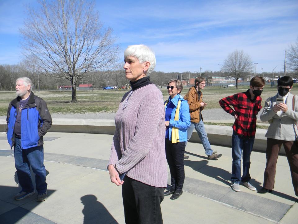 Pastor Sharon Youngs of First Presbyterian Church of Oak Ridge speaks to participants at a prayer vigil at the International Friendship Bell in Oak Ridge.