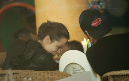 Brad Pitt and Angelina Jolie enjoy lunch with adopted child Zahara in Berlin. [Image by Sean Gallup/Getty Images]