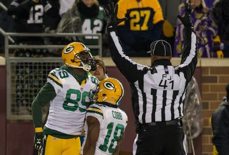 Green Bay Packers wide receiver James Jones (89) celebrates his touchdown with wide receiver Randall Cobb (18) during the fourth quarter against the Minnesota Vikings at TCF Bank Stadium. The Packers defeated the Vikings 30-15. Mandatory Credit: Brace Hemmelgarn-USA TODAY Sports