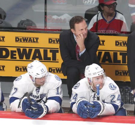 Apr 20, 2014; Montreal, Quebec, CAN; Tampa Bay Lightning head coach Jon Cooper watches from behind the bench in the last minute of the game against the Montreal Canadiens in the game three of the first round of the 2014 Stanley Cup Playoffs at Bell Centre. Mandatory Credit: Jean-Yves Ahern-USA TODAY Sports