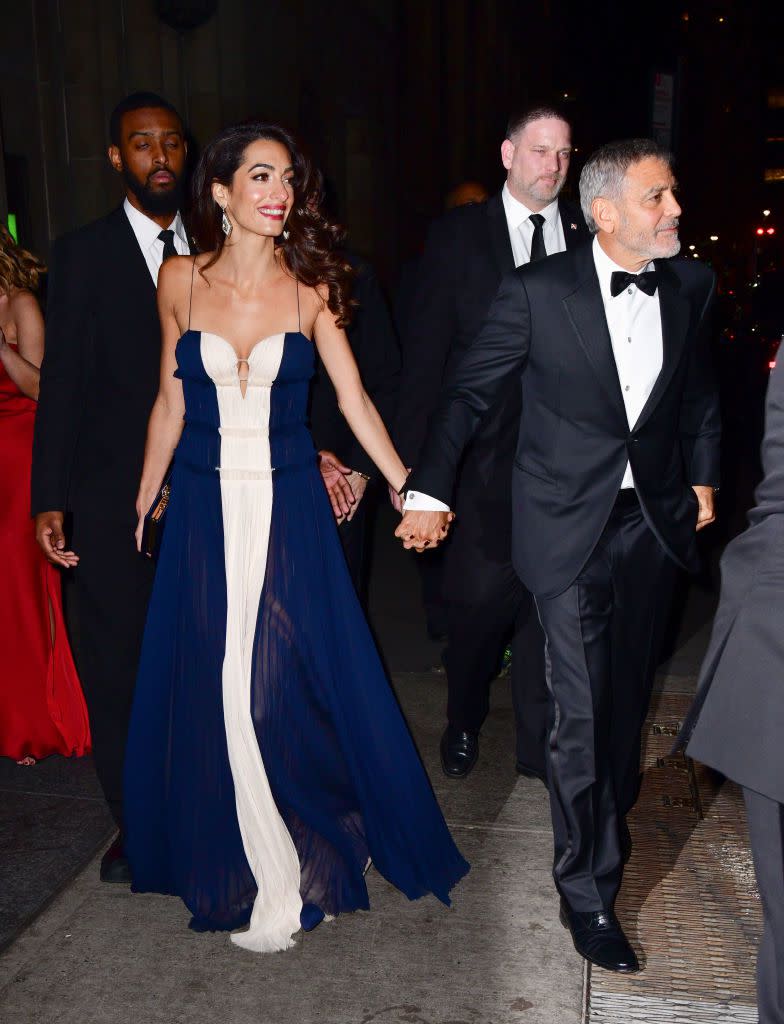 <p>Amal wore a navy and white gown by J. Mendel to the United Nations Correspondents Associations Awards in New York City. The human rights lawyer complimented the dress's sweet-heart neckline with simple accessories of diamond statement earrings and a navy box clutch. </p><p><a class="link " href="https://www.barneys.com/product/j.-mendel-colorblocked-silk-pliss-c3-a9-cocktail-gown-506062889.html" rel="nofollow noopener" target="_blank" data-ylk="slk:SHOP SIMILAR;elm:context_link;itc:0;sec:content-canvas">SHOP SIMILAR </a> <em>Color-blocked Silk Plissé Cocktail Gown, J. Mendel, $4,490</em></p>