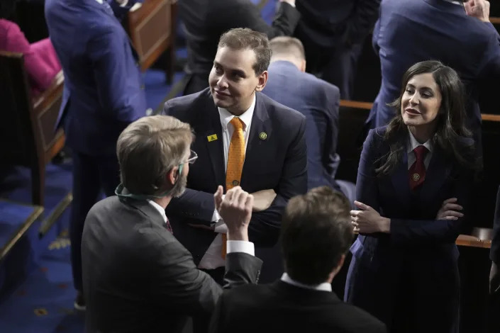 Rep. George Santos, R-N.Y., talks with people before President Joe Biden arrives to deliver the State of the Union address to a joint session of Congress at the U.S. Capitol, Tuesday, Feb. 7, 2023, in Washington. (AP Photo/Patrick Semansky)