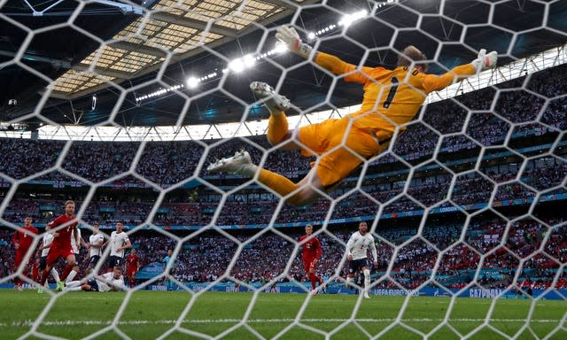 Jordan Pickford dives in vain as Mikkel Damsgaard's free-kick gives Denmark the lead