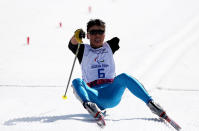 <div>STRUGGLE - Ganbold Batmunkh of Mongolia reacts after crossing the finish line in the Men's 20km Standing event during day three of Sochi 2014 Paralympic Winter Games.</div>