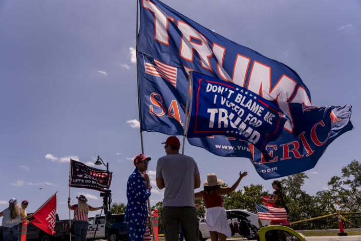 Former President Trump supporters gather outside Mar-a-Lago, his residence in Palm Beach, Fla., on March 21, 2023. (Josh Ritchie/The New York Times)