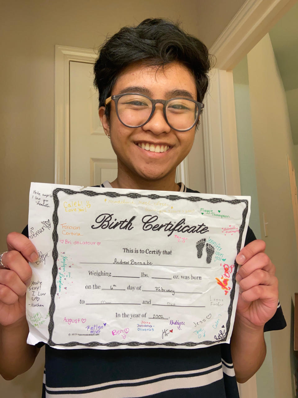 Andi with the birth certificate that his friends made him. (Photo: Andi Bernabe) 