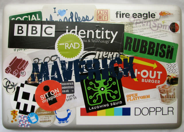 macbook covered in stickers