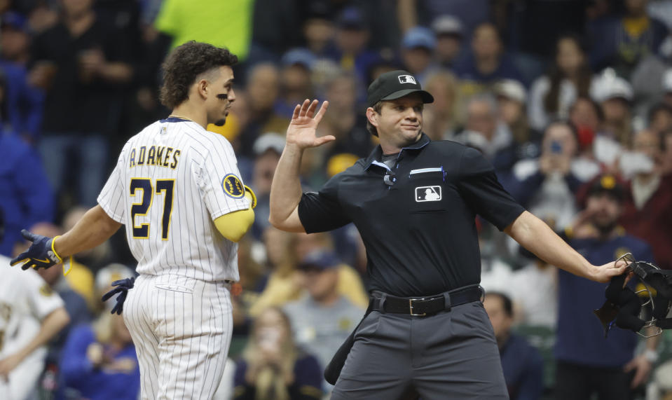 Milwaukee Brewers' Willy Adames (27) is thrown out of a baseball game by home plate umpire Adam Beck during the seventh inning against the Los Angeles Angels, Saturday, April 29, 2023, in Milwaukee. (AP Photo/Jeffrey Phelps)
