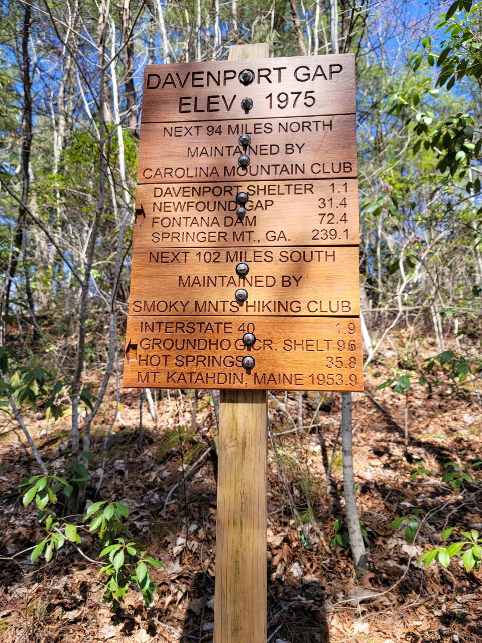 Veterans Outreach intern Gessika Guerra will coordinate a trail maintenance event with Carolina Mountain Club, which installed this sign at Davenport Gap on the Appalachian National Scenic Trail.