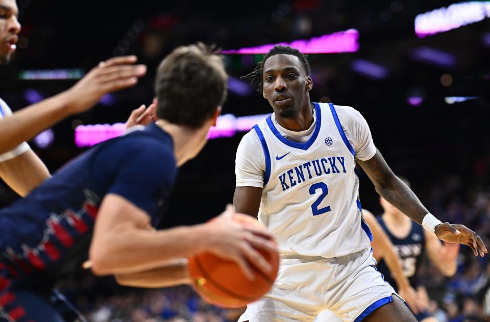 Dec 9, 2023; Philadelphia, Pennsylvania, USA; Kentucky Wildcats forward Aaron Bradshaw (2) defends Penn Quakers guard Clark Slajchert (0) in the first half at Wells Fargo Center.