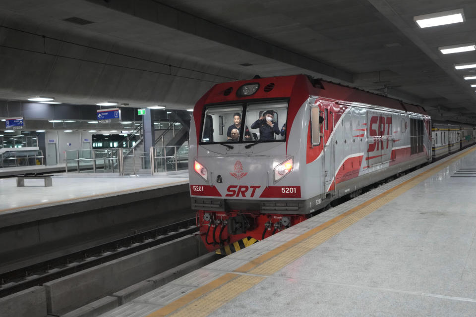 A train departs for the southern Narathiwat province at the Krung Thep Aphiwat Central Terminal in Bangkok, Thailand, Thursday, Jan. 19, 2023. Thailand ushered in a new age of train travel on Thursday when what’s said to be Southeast Asia’s biggest railway station officially began operations. (AP Photo/Sakchai Lalit)