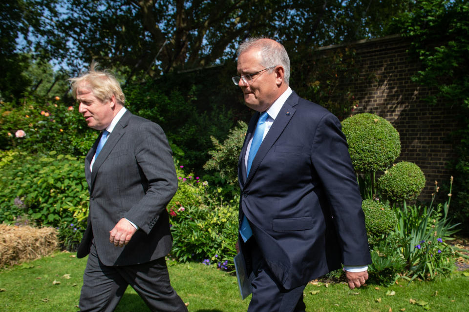 Prime minister Boris Johnson with his Australian counterpart Scott Morrison walk in the garden of 10 Downing street in London on 15 June. Photo: Dominic Lipinski/AFP via Getty Images