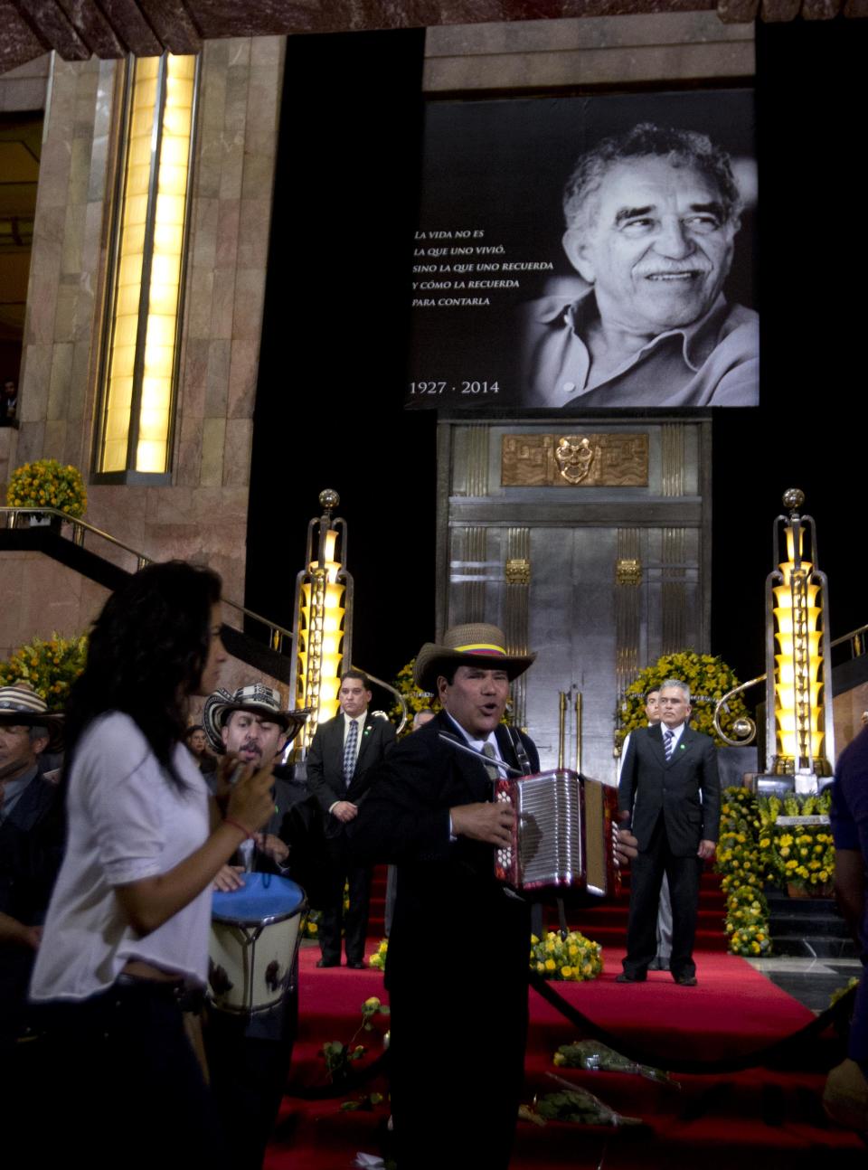 Musicians perform in front of the urn containing the ashes of Colombian Nobel Literature laureate Gabriel Garcia Marquez during an homage to the celebrated author in the Palace of Fine Art in Mexico City, Monday, April 21, 2014. The ashes of Garcia Marquez were taken Monday to Mexico City's majestic Palace of Fine Arts, where thousands of admirers began paying tribute to the Colombian Nobel laureate considered one of the greatest Spanish-language authors of all time. (AP Photo/Eduardo Verdugo)