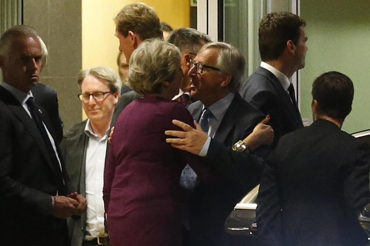 Prime Minister Theresa May is greeted by European Commission President Jean-Claude Juncker while leaving the European Commission headquarters: REUTERS