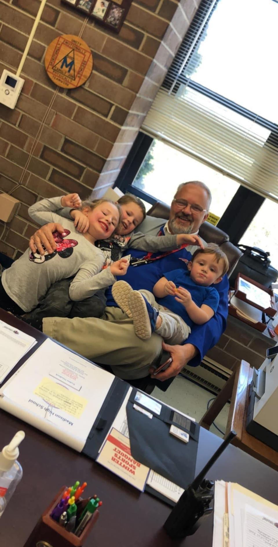 David Robinson poses for a photo with his three oldest grandchildren, from left, Harper, 7, Easton, 5 and Bentley, 3.