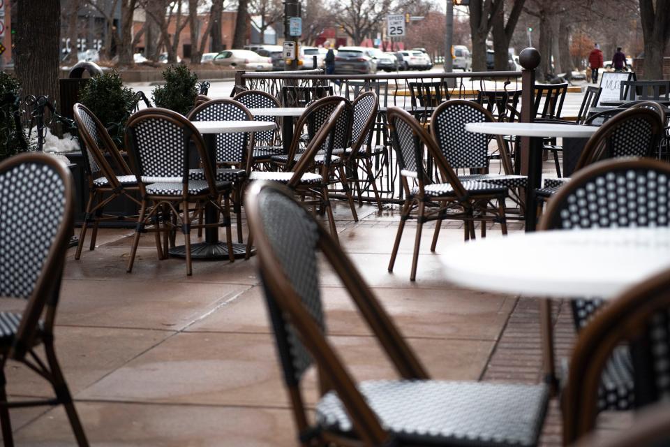 Tables and chairs are set up for outdoor dining at the entrance to the Armstrong Hotel in Fort Collins on Friday. Nearly two years into the COVID-19 pandemic, the city of Fort Collins is considering a move to make its COVID-born expanded outdoor patio program permanent.