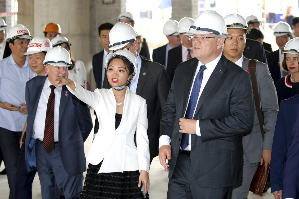 FILE - In this Aug. 23, 2019, file photo, Australian Prime Minister Scott Morrison, right, visits the Hanoi Formula One Grand Prix construction site in Hanoi. (AP Photo/Duc Thanh, File)