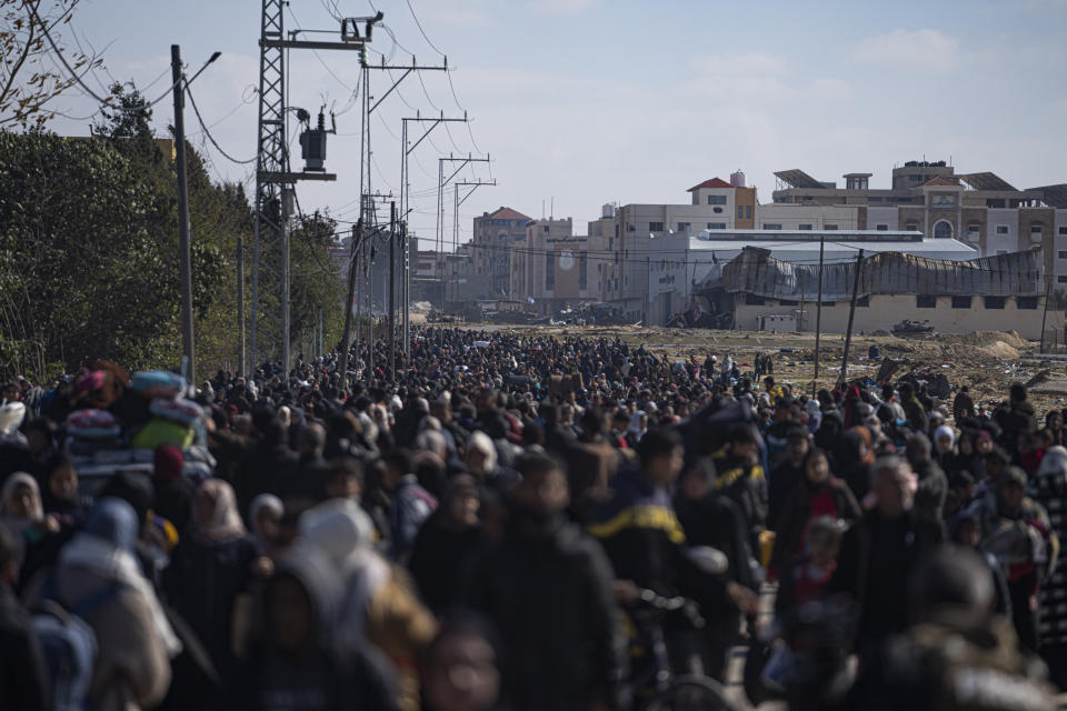 Palestinians arrive in the southern Gaza town of Rafah after fleeing an Israeli ground and air offensive in the nearby city of Khan Younis on Friday, Jan. 26, 2024. Israel has expanded its offensive in Khan Younis, saying the city is a stronghold of the Hamas militant group. (AP Photo/Fatima Shbair)