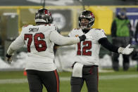 Tampa Bay Buccaneers quarterback Tom Brady celebrates with Donovan Smith after winning the NFC championship NFL football game in Green Bay, Wis., Sunday, Jan. 24, 2021. The Buccaneers defeated the Packers 31-26 to advance to the Super Bowl. (AP Photo/Morry Gash)