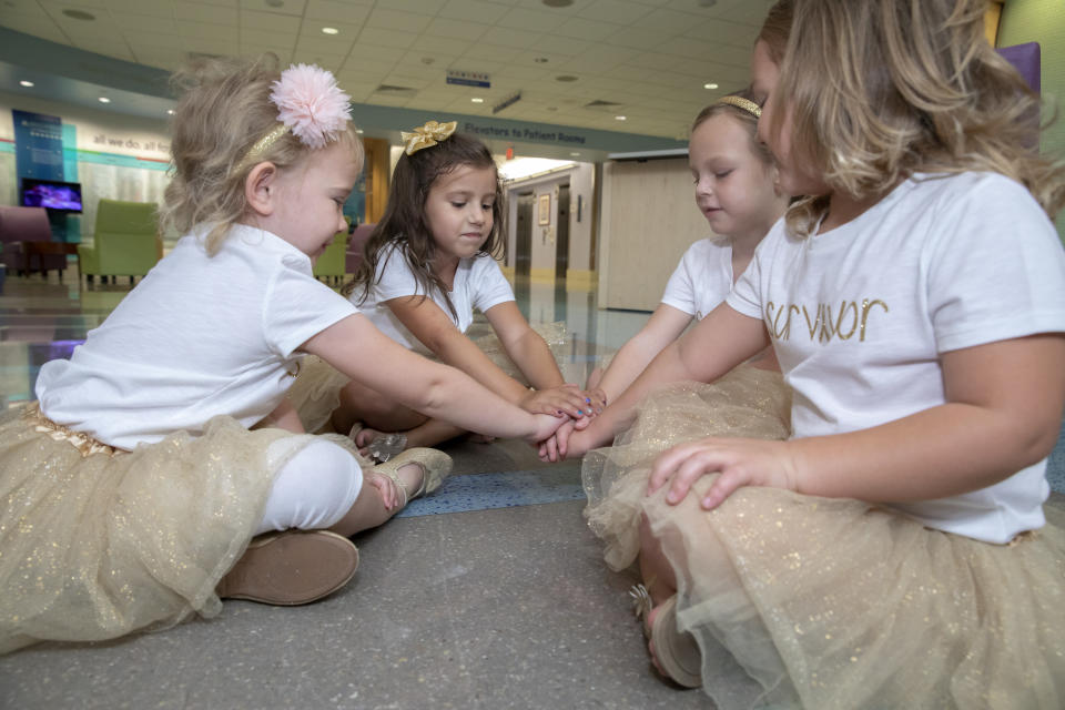 The girls reunite, tutus and all, in 2018 to remake their original photo at Johns Hopkins All Children’s Hospital. (Photo: Johns Hopkins All Children’s Hospital)