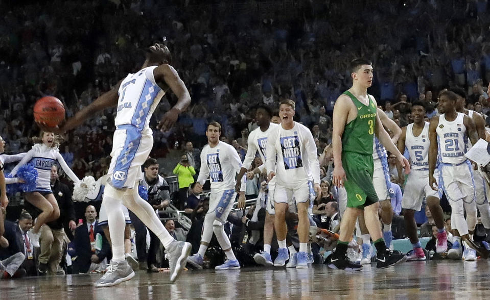 North Carolina's Theo Pinson (1) celebrates as Oregon's Payton Pritchard (3) walks off the court after the semifinals of the Final Four NCAA college basketball tournament, Saturday, April 1, 2017, in Glendale, Ariz. North Carolina won 77-76. (AP Photo/David J. Phillip)