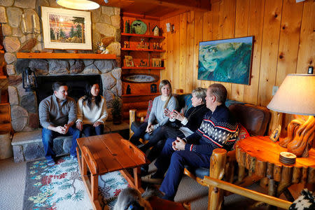 Hannah Brandt (C) and her adopted sister Marissa (2nd L) celebrate Christmas with their parents Greg and Robin along with Marissa's husband Brett Ylonen (L) at their home in St. Paul, Minnesota, U.S., December 25, 2017. REUTERS/Adam Bettcher