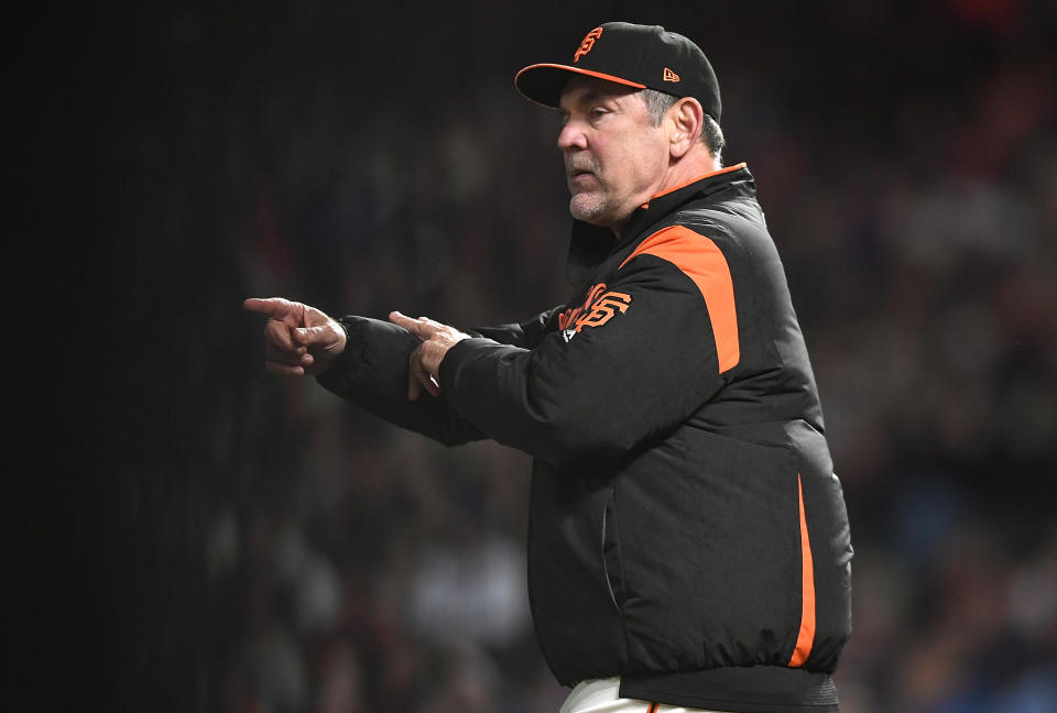 SAN FRANCISCO, CA - APRIL 28:  Manager Bruce Bochy #15 of the San Francisco Giants comes out an signals the bullpen to make a pitching change against the Los Angeles Dodgers in the top of the seventh inning of game two of a double header at AT&T Park on April 28, 2018 in San Francisco, California.  (Photo by Thearon W. Henderson/Getty Images)