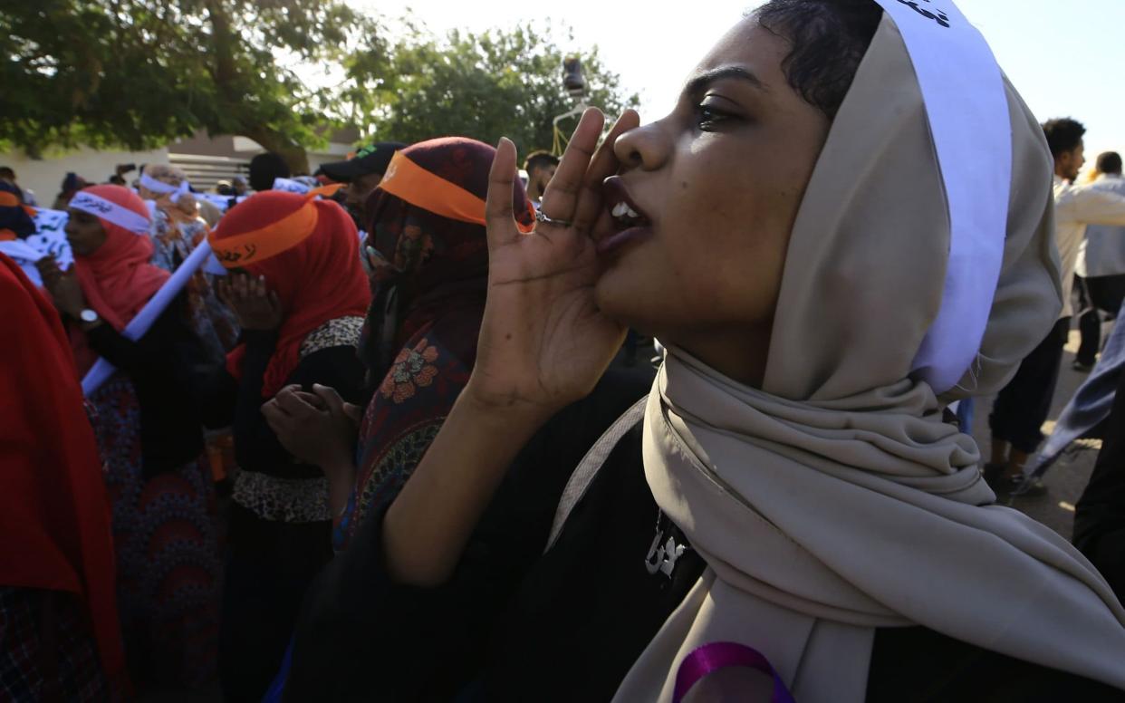 Women marching in Khartoum to protest against violence against women - AFP