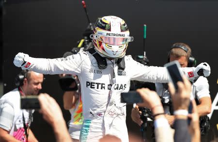 Britain Formula One - F1 - British Grand Prix 2016 - Silverstone, England - 10/7/16 Mercedes' Lewis Hamilton celebrates after winning the race REUTERS/Matthew Childs Livepic