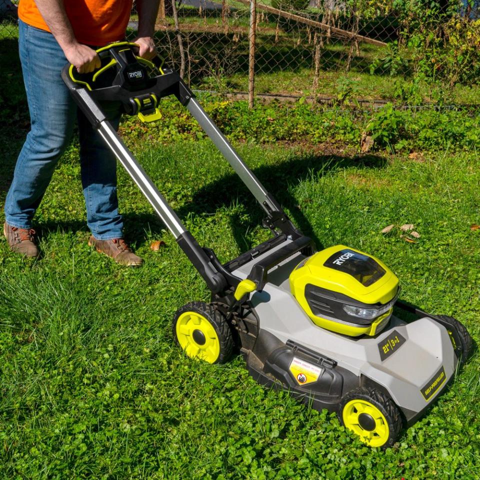 a person using a lawn mower