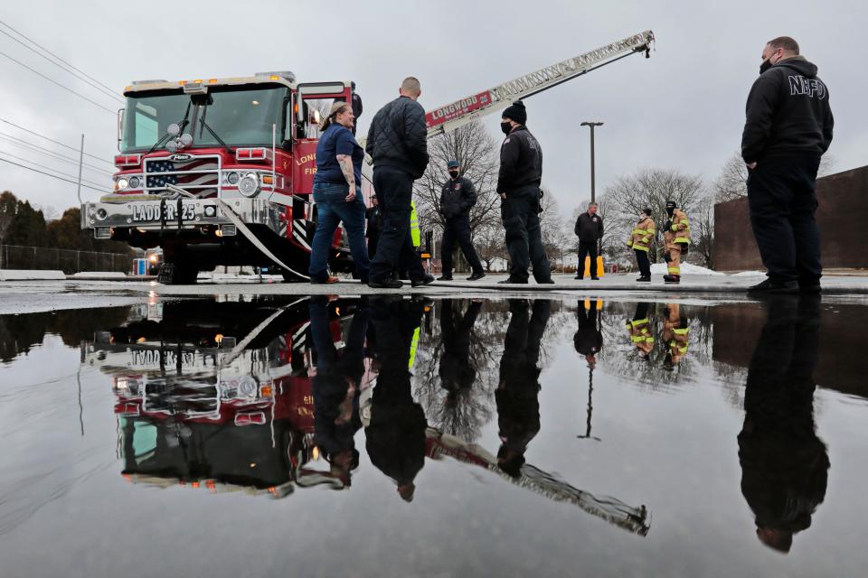 In this file photo, New Bedford Station 8 firefighters take a look at the newly arrived quint apparatus for the first time. New Bedford Fire Chief Scott Kruger says programming focused on firefighters' mental health is crucial.