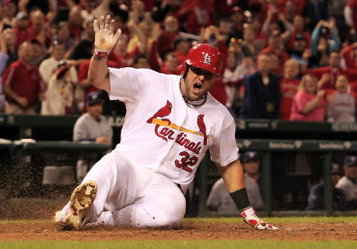 Matt Adams celebrates as he scores the game-winning run on a single by Tony Cruz. (AP)