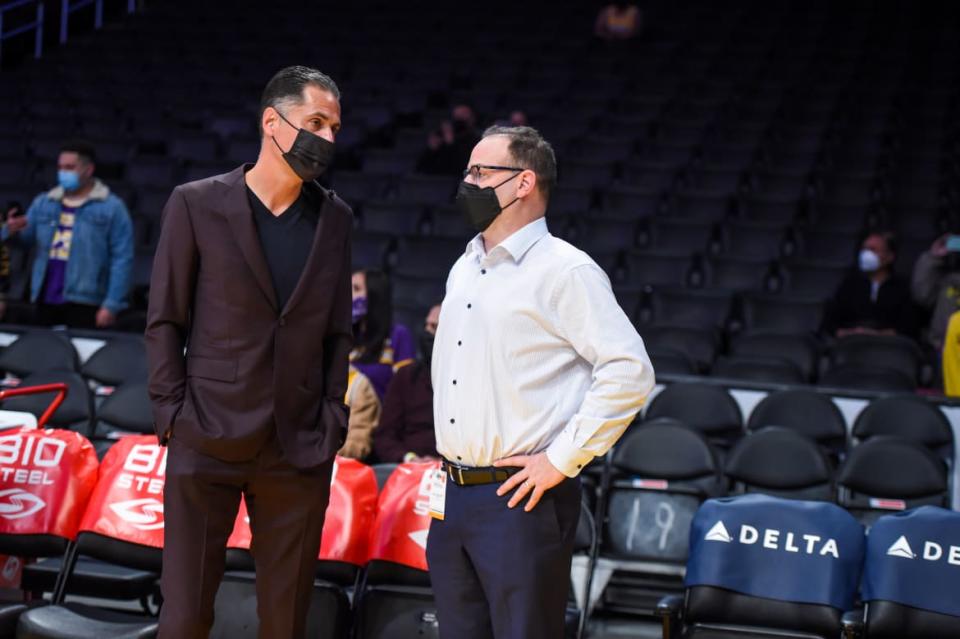 <div class="inline-image__caption"><p>General Manager, Rob Pelinka of the Los Angeles Lakers chats with ESPN Analyst, Adrian Wojnarowski before the game against the Utah Jazz on January 17, 2022, at Crypto.Com Arena in Los Angeles, California. </p></div> <div class="inline-image__credit">Tyler Ross/Getty</div>
