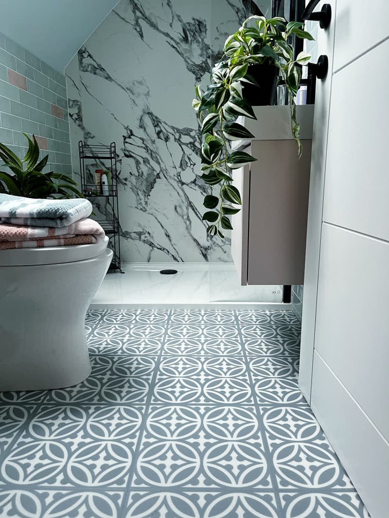 Patterned tile in newly renovated bathroom.