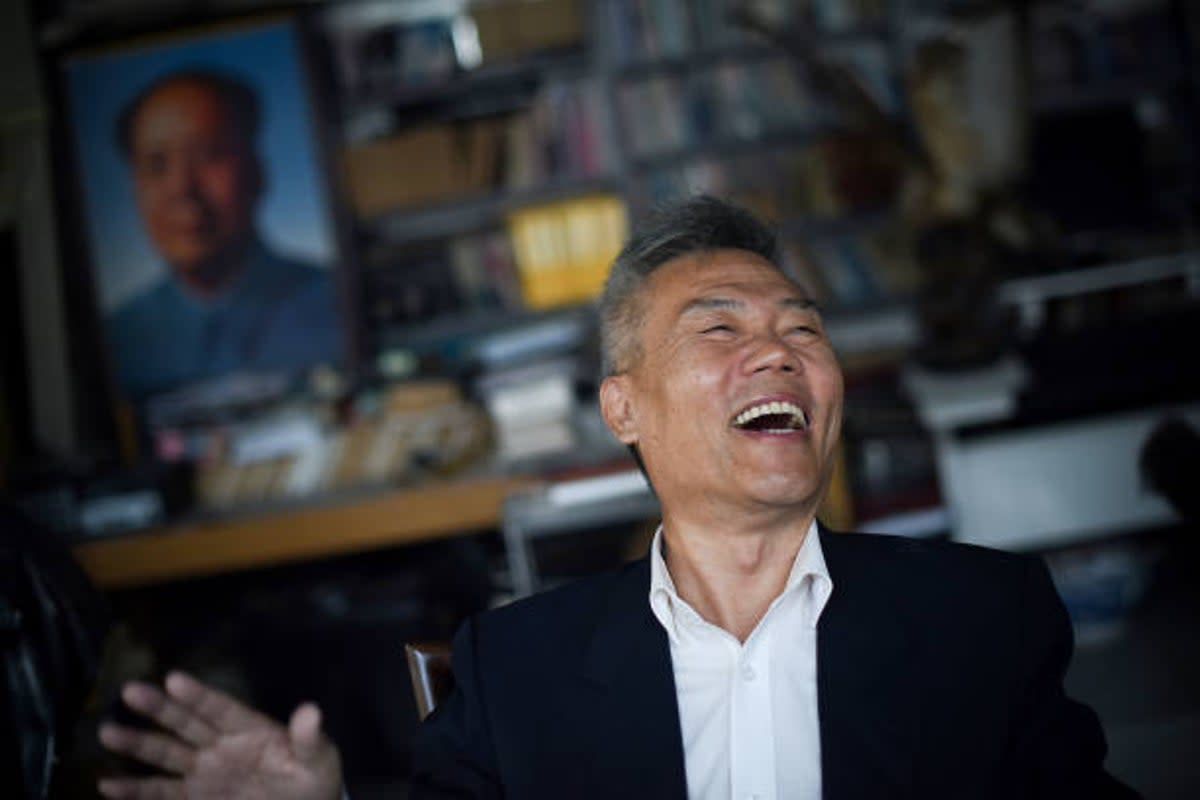 File photo: Prominent social commentator Sima Nan laughing during an interview in Beijing (AFP via Getty Images)