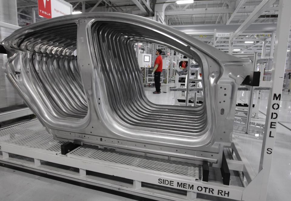 Tesla Model S frames are shown in the assembly area at the Tesla factory in Fremont, Calif., Friday, June 22, 2012. The first Model S sedan car will be rolling off the assembly line on Friday. (AP Photo/Paul Sakuma)