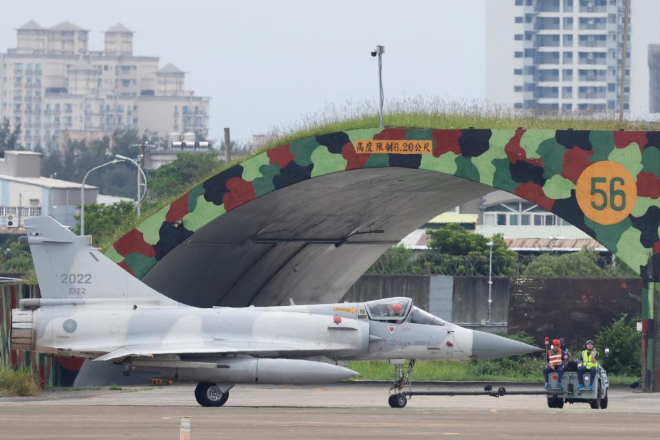 A Taiwan Air Force Mirage 2000-5 aircraft is transported by ground staff at Hsinchu Air Base in Hsinchu (Reuters)