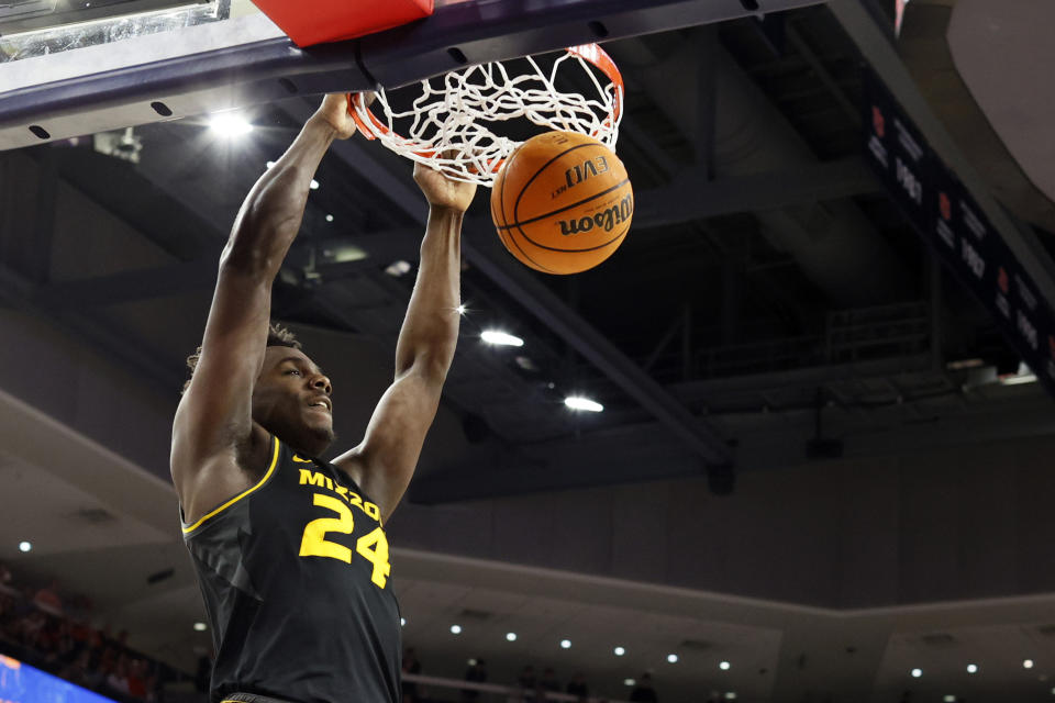 Missouri guard Kobe Brown slam dunks the ball during the first half of an NCAA college basketball game against Auburn, Tuesday, Feb. 14, 2023, in Auburn, Ala. (AP Photo/Butch Dill)