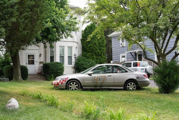 PHOTO: A car with decals is parked outside of the house where Robert Crimo III, a person of interest in the July 4th parade shooting, lives in the Chicago suburb of Highwood, Ill., on July 5, 2022. (Max Herman/AFP via Getty Images)