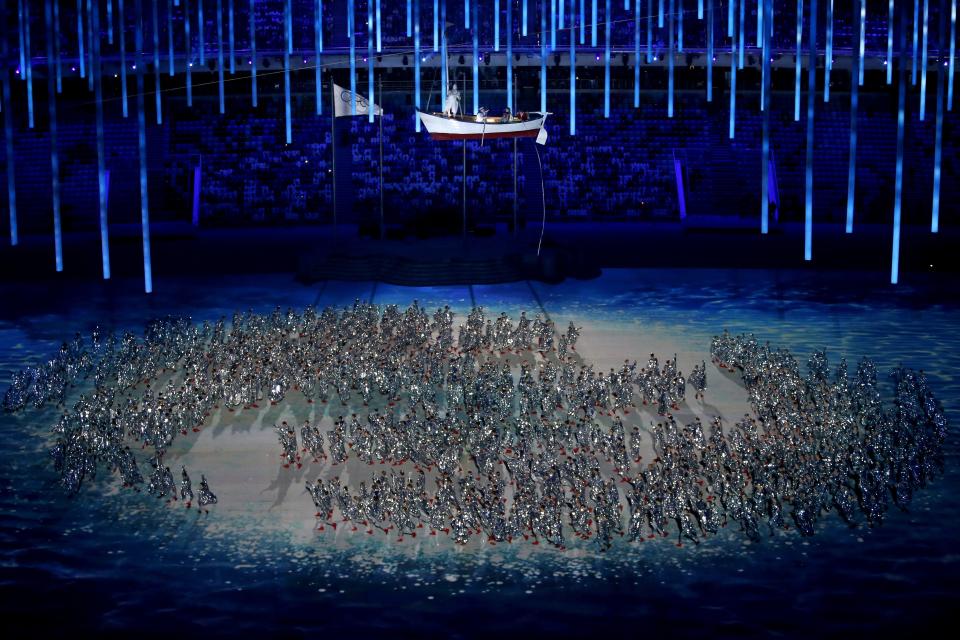 Dancers perform at the start of the Closing Ceremony of the Sochi Winter Olympics at the Fisht Olympic Stadium on February 23, 2014.   AFP PHOTO / ADRIAN DENNIS        (Photo credit should read ADRIAN DENNIS/AFP/Getty Images)