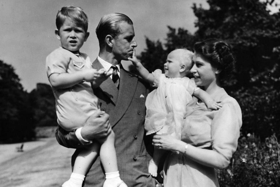 The Queen stands with her husband Prince Philip in 1951 with Prince Charles and Princess Anne (AP)